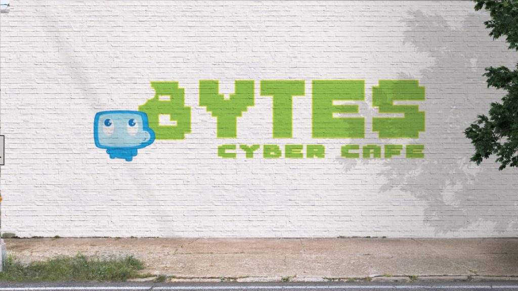 Bytes Cyber Cafe logo advertising on a white brick wall