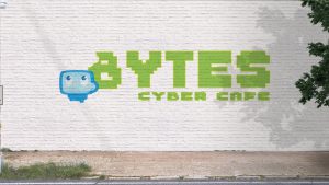 Bytes Cyber Cafe logo advertising on a white brick wall